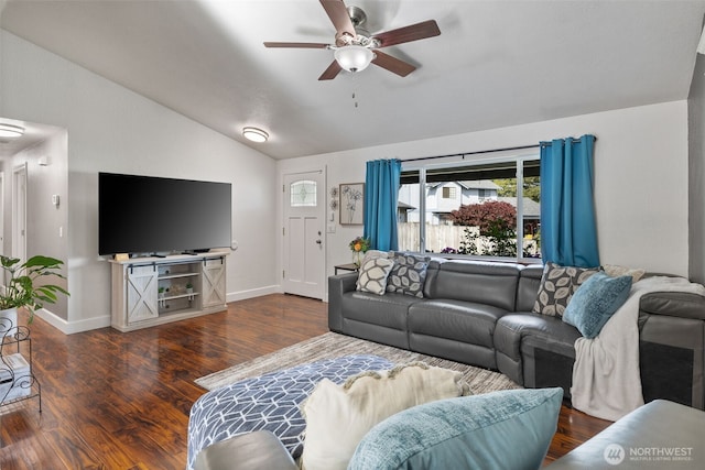 living area featuring vaulted ceiling, ceiling fan, baseboards, healthy amount of natural light, and wood finished floors