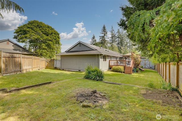 rear view of house featuring a wooden deck, a shed, and an outdoor structure