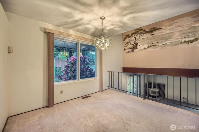 23238 21st Ave S, Des Moines, WA 98198 - unfurnished living room with carpet floors, healthy amount of natural light, and a chandelier