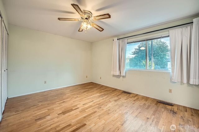 23238 21st Ave S, Des Moines, WA 98198 - spare room featuring light wood-type flooring, ceiling fan, and baseboards