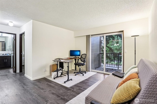 14650 NE 32nd St Unit A14, Bellevue, WA 98007 - home office with wood finished floors, a textured ceiling, and baseboards