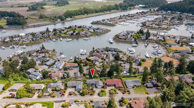 228 Skagit Way, La Conner, WA 98257 - aerial overview of property's location featuring a nearby body of water, numerous boat docks, and nearby suburban area
