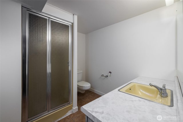 228 Skagit Way, La Conner, WA 98257 - full bathroom featuring a stall shower, toilet, tile patterned flooring, and vanity
