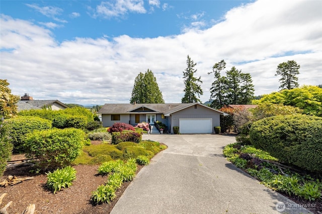 228 Skagit Way, La Conner, WA 98257 - ranch-style home featuring an attached garage and asphalt driveway