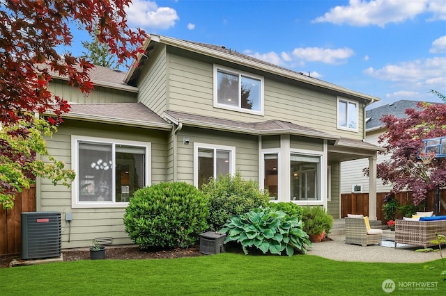 rear view of property featuring an outdoor hangout area, central AC unit, and a patio area
