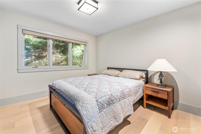 1248 Kanaka Bay Rd, Friday Harbor, WA 98250 - bedroom with baseboards and wood finished floors