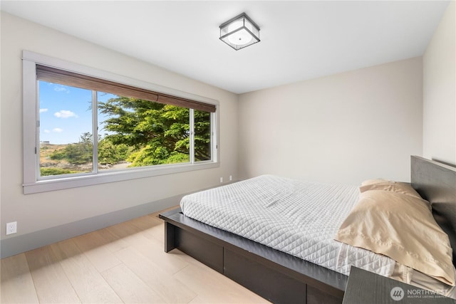 1248 Kanaka Bay Rd, Friday Harbor, WA 98250 - bedroom featuring baseboards and wood finished floors