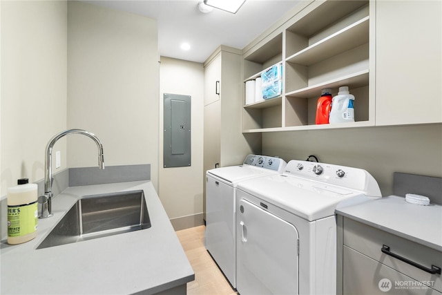 1248 Kanaka Bay Rd, Friday Harbor, WA 98250 - laundry area with electric panel, cabinet space, separate washer and dryer, light wood-style floors, and recessed lighting