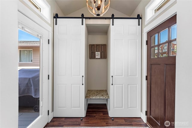 250 Lakefront Dr, Orondo, WA 98843 - foyer entrance featuring vaulted ceiling, dark wood-style floors, and a barn door