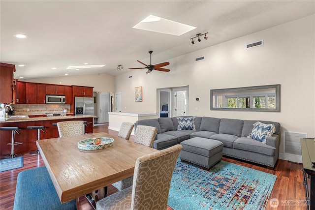 250 Lakefront Dr, Orondo, WA 98843 - dining room featuring vaulted ceiling, a skylight, dark wood-style floors, ceiling fan, and recessed lighting