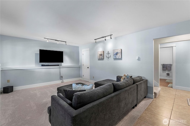 250 Lakefront Dr, Orondo, WA 98843 - living room featuring rail lighting, light tile patterned flooring, and baseboards