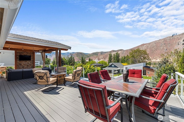 250 Lakefront Dr, Orondo, WA 98843 - wooden deck featuring an outdoor living space with a fire pit and outdoor dining area