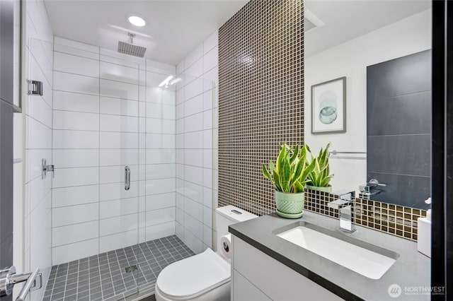 4216 30th Ave SW, Seattle, WA 98126 - full bath with a stall shower, vanity, toilet, tile walls, and backsplash