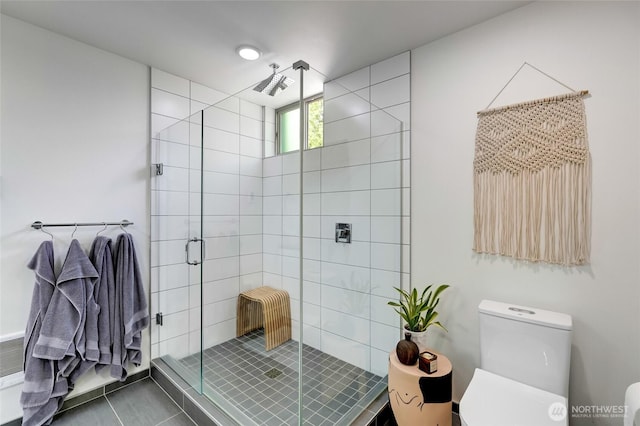 4216 30th Ave SW, Seattle, WA 98126 - bathroom featuring toilet, a stall shower, and tile patterned flooring