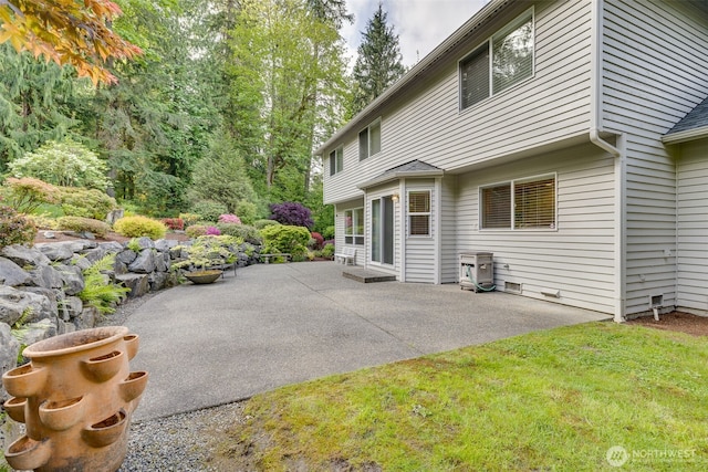 rear view of property with a patio area and a lawn