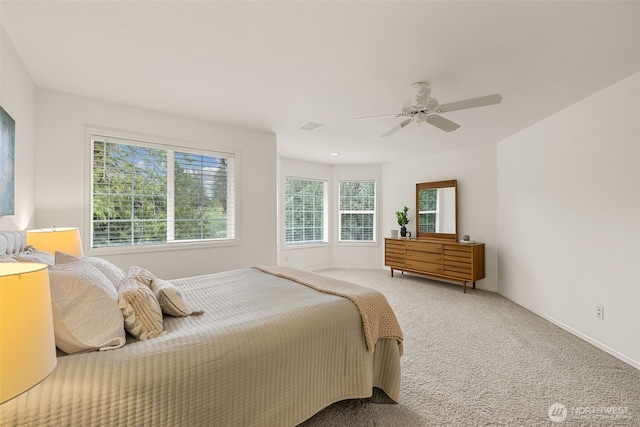 bedroom with carpet, a ceiling fan, and baseboards
