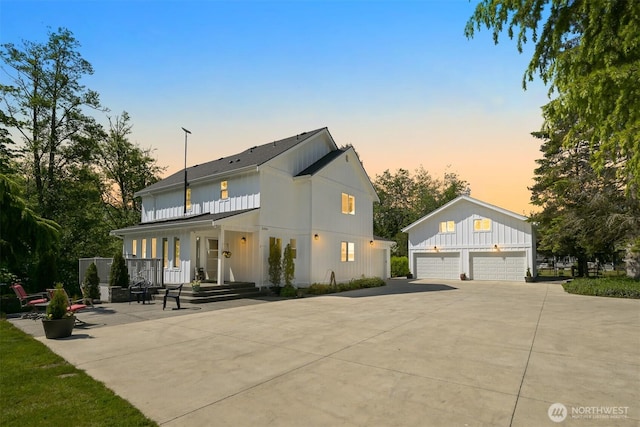 8894 Giles Rd, Blaine, WA 98230 - view of front of home featuring board and batten siding, a garage, a porch, and a shingled roof