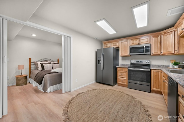 8894 Giles Rd, Blaine, WA 98230 - kitchen with appliances with stainless steel finishes, light wood-style floors, a sink, and light stone countertops