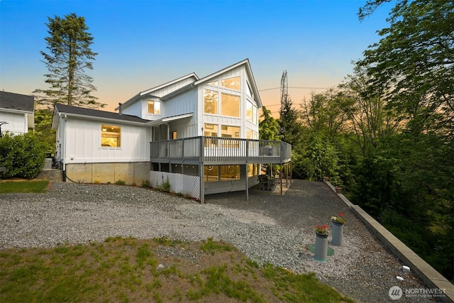 8894 Giles Rd, Blaine, WA 98230 - back of house featuring a wooden deck, board and batten siding, and driveway