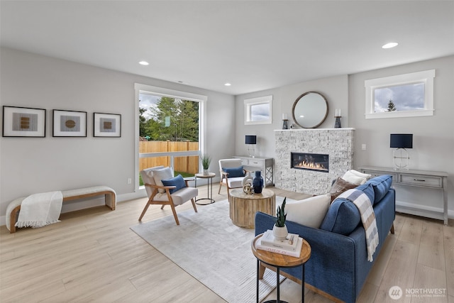 20029 7th Ave SE, Bothell, WA 98012 - living room with a fireplace, light wood-style flooring, recessed lighting, and baseboards