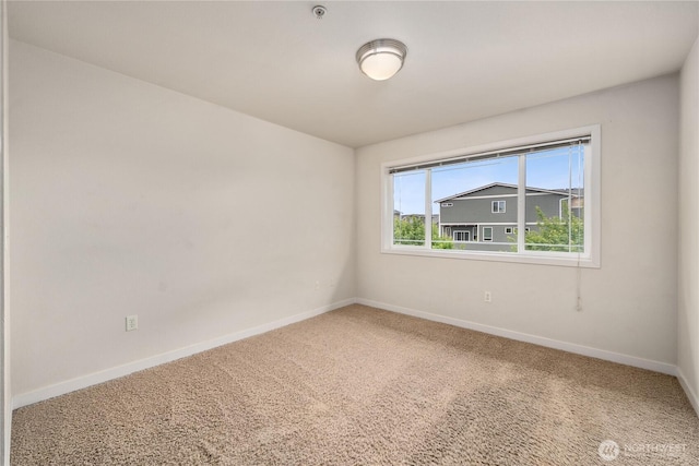 13426 97th Ave E Unit 303, Puyallup, WA 98373 - carpeted empty room with baseboards and a pendent fire sprinkler