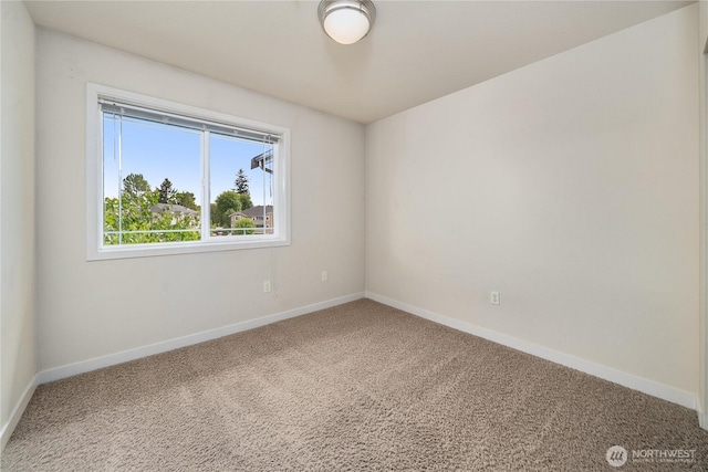 13426 97th Ave E Unit 303, Puyallup, WA 98373 - spare room featuring carpet and baseboards