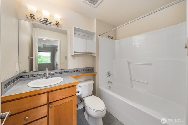 13426 97th Ave E Unit 303, Puyallup, WA 98373 - full bathroom featuring toilet, bathtub / shower combination, vanity, and tile patterned flooring
