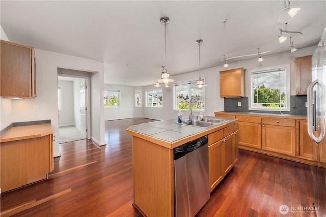 13426 97th Ave E Unit 303, Puyallup, WA 98373 - kitchen with stainless steel dishwasher, a sink, dark wood finished floors, and an island with sink