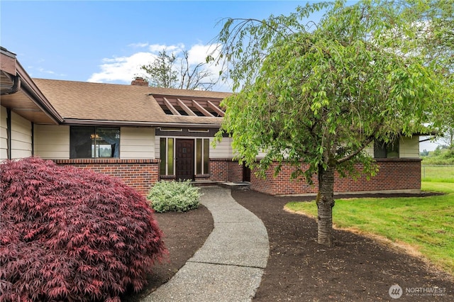 1826 156th St NE, Arlington, WA 98223 - view of front of property with brick siding, a chimney, and a shingled roof