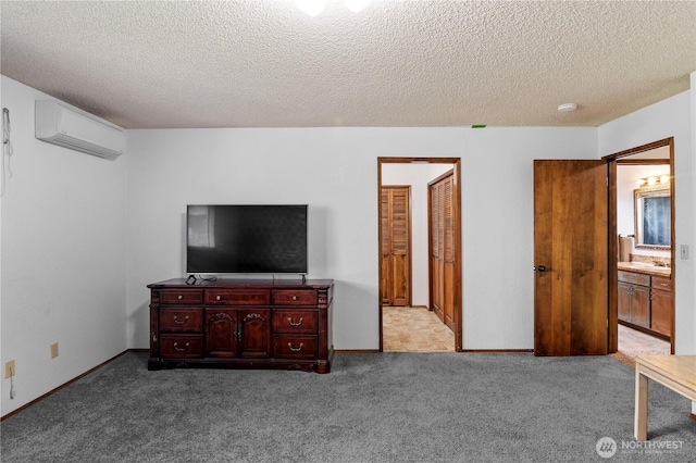 1826 156th St NE, Arlington, WA 98223 - carpeted bedroom featuring an AC wall unit, a textured ceiling, and connected bathroom