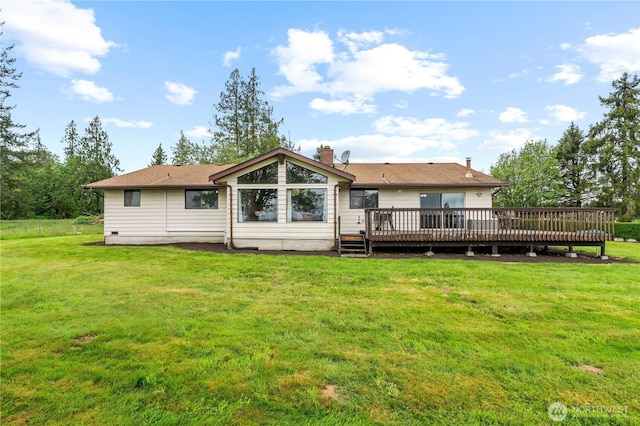 1826 156th St NE, Arlington, WA 98223 - back of property featuring a deck, a lawn, and a chimney