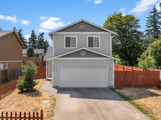 10102 Barnes Ln S, Tacoma, WA 98444 - traditional-style home with driveway and an attached garage