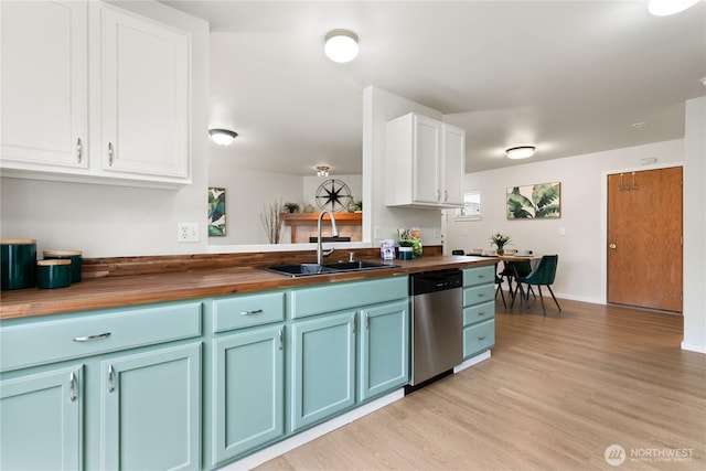 9402 187th St E, Puyallup, WA 98375 - kitchen with dishwasher, wooden counters, a sink, and blue cabinets
