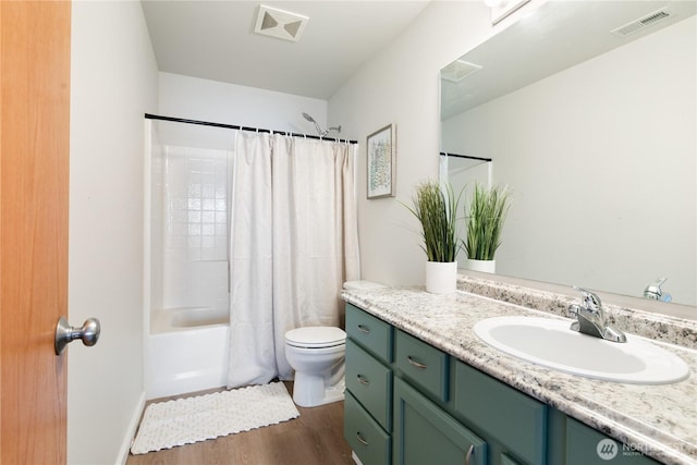 9402 187th St E, Puyallup, WA 98375 - bathroom with vanity, wood finished floors, toilet, and shower / bath combination with curtain