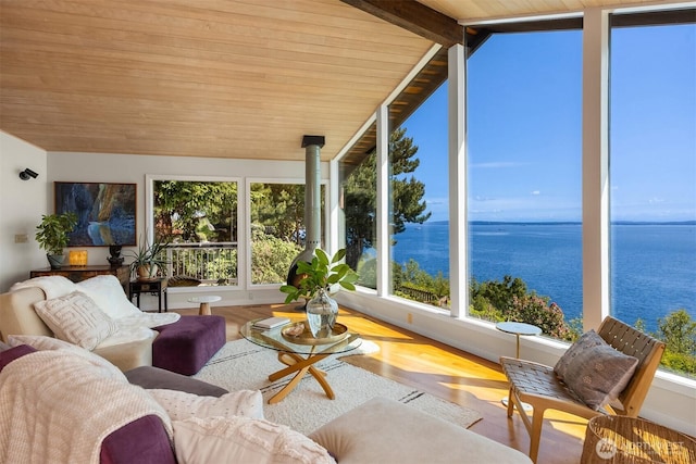161 Montgomery Ln, Port Ludlow, WA 98365 - sunroom / solarium with wood ceiling, wood finished floors, vaulted ceiling, and a water view