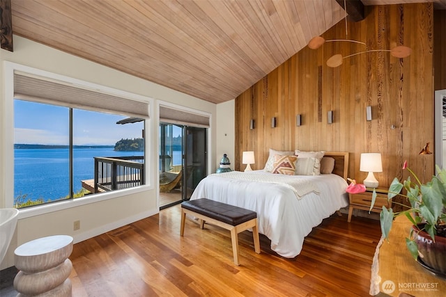 161 Montgomery Ln, Port Ludlow, WA 98365 - bedroom featuring access to outside, wooden walls, wood finished floors, wooden ceiling, and a water view