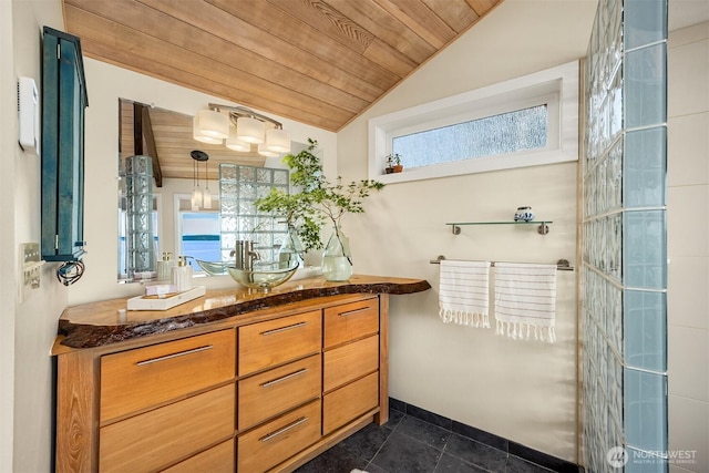 161 Montgomery Ln, Port Ludlow, WA 98365 - full bath featuring vaulted ceiling, wood ceiling, vanity, and baseboards