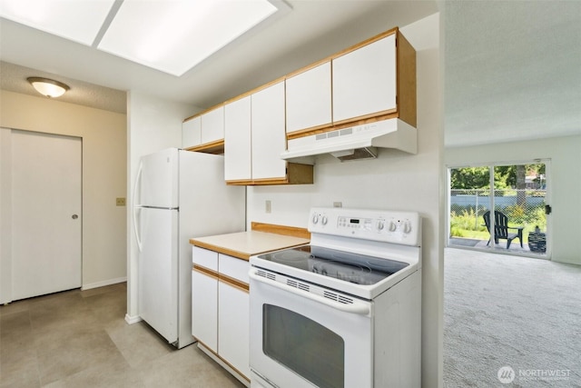 kitchen with white appliances, under cabinet range hood, white cabinets, and light countertops