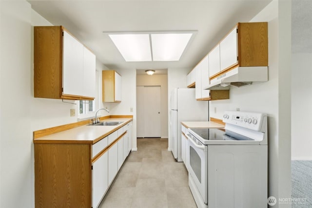 kitchen with white appliances, a sink, under cabinet range hood, light countertops, and white cabinetry