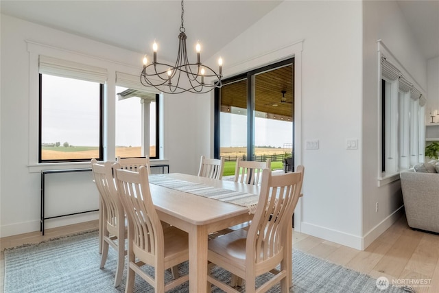 53 Daybreak Rd, Walla Walla, WA 99362 - dining area featuring a chandelier, light wood-style floors, and baseboards