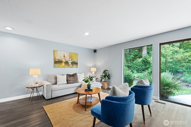 12043 184th Ave NE, Redmond, WA 98052 - living room featuring wood finished floors and recessed lighting