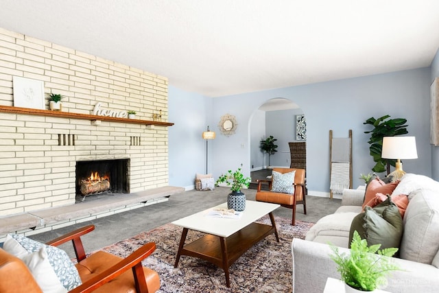 12043 184th Ave NE, Redmond, WA 98052 - living room with arched walkways, carpet, and a fireplace