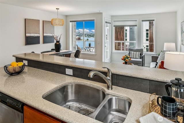 2432 Dexter Ave N Unit 201, Seattle, WA 98109 - kitchen with a sink, dishwasher, hanging light fixtures, a water view, and light countertops