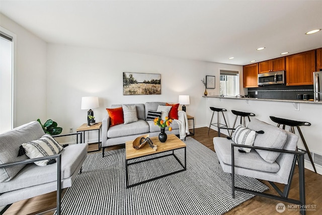 2432 Dexter Ave N Unit 201, Seattle, WA 98109 - living room featuring wood finished floors, recessed lighting, and baseboards