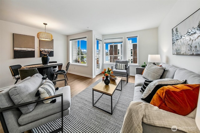 2432 Dexter Ave N Unit 201, Seattle, WA 98109 - living area featuring wood finished floors and baseboards