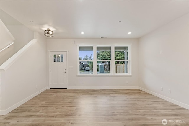 entrance foyer with light wood-style floors, recessed lighting, and baseboards