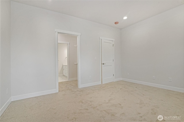 carpeted spare room with recessed lighting and baseboards