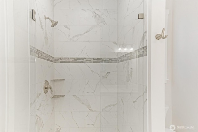 bathroom with a shower stall