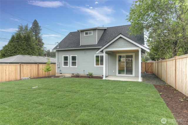 rear view of property featuring roof with shingles and a patio