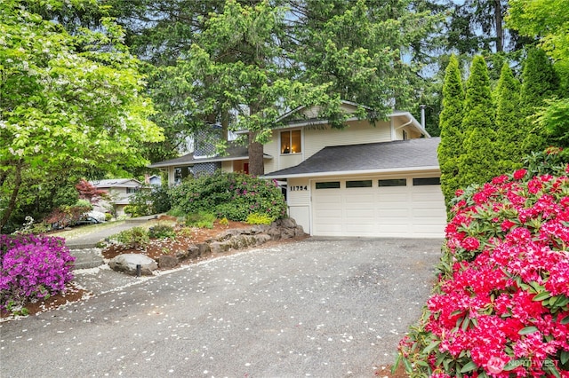 view of front of house featuring driveway and an attached garage